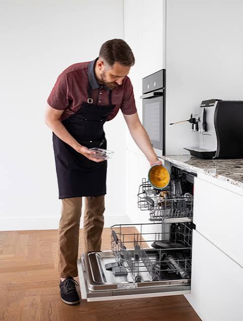 Open built-in dishwasher in a modern kitchen